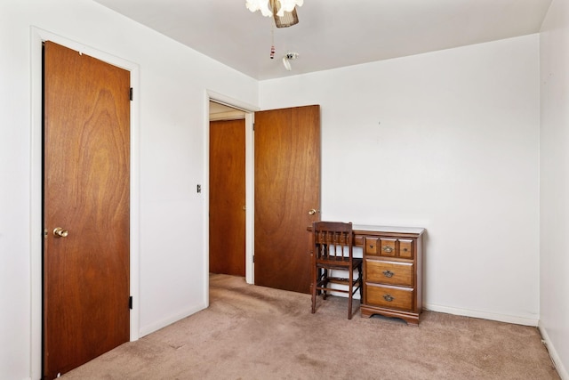 carpeted bedroom featuring baseboards