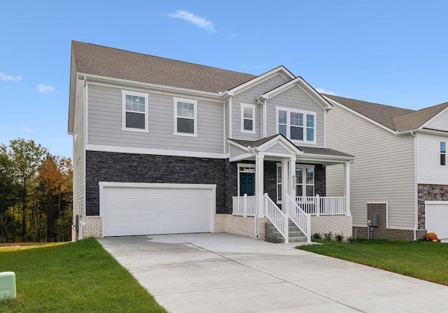 view of front of house featuring an attached garage, covered porch, a front lawn, and concrete driveway