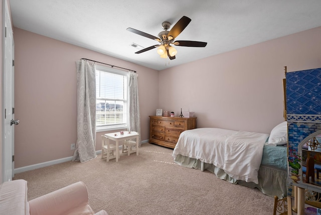 carpeted bedroom with a ceiling fan, visible vents, and baseboards