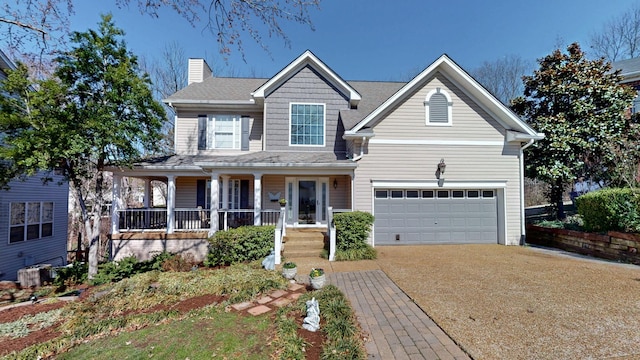 view of front of home with driveway, a garage, central AC unit, a chimney, and a porch