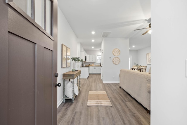 foyer entrance with recessed lighting, visible vents, ceiling fan, light wood-type flooring, and baseboards