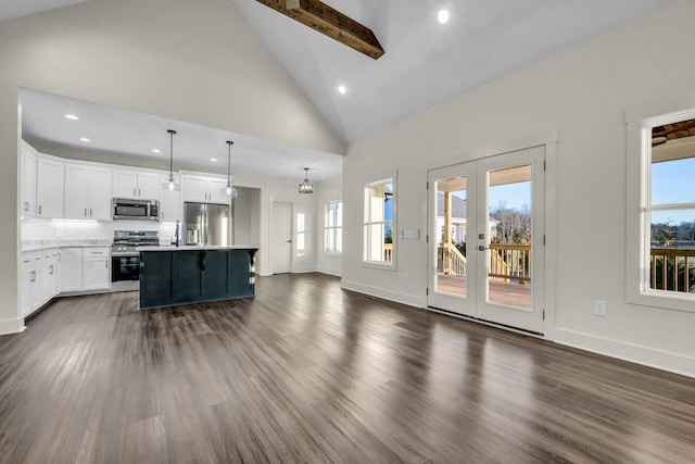 living area featuring dark wood-style floors, a wealth of natural light, french doors, and high vaulted ceiling