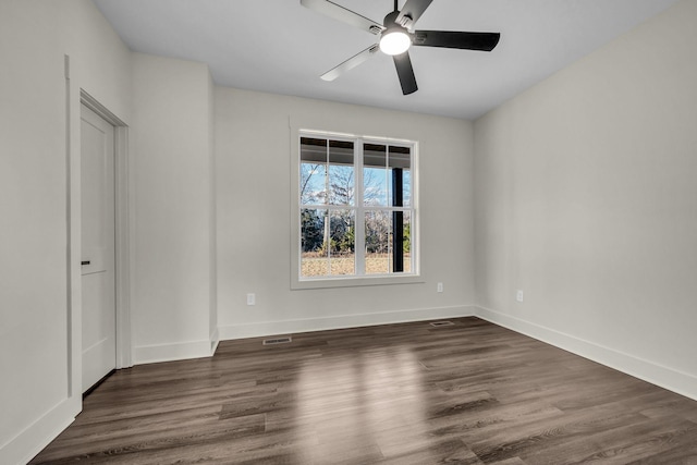 interior space with visible vents, baseboards, ceiling fan, and wood finished floors