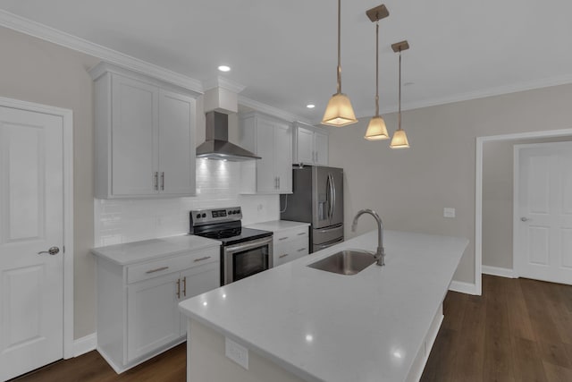 kitchen featuring a sink, backsplash, appliances with stainless steel finishes, wall chimney range hood, and dark wood-style flooring