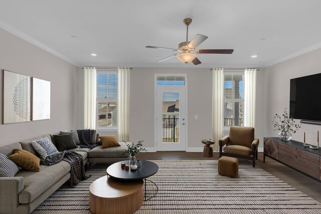 living room with recessed lighting, wood finished floors, baseboards, and ornamental molding