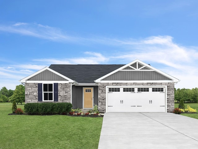 view of front of home with an attached garage, stone siding, driveway, a front lawn, and board and batten siding