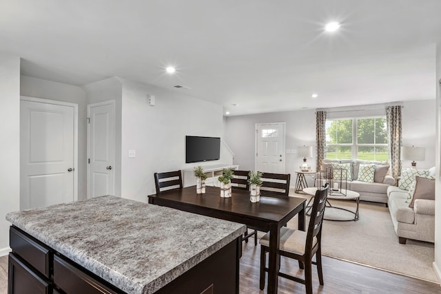 dining room featuring recessed lighting, visible vents, and wood finished floors