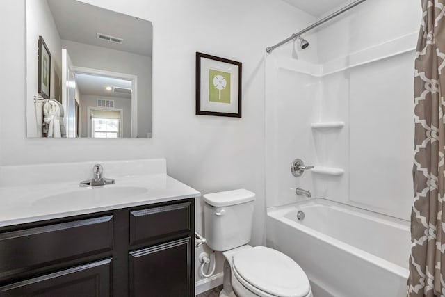 bathroom with toilet, shower / tub combo, visible vents, and vanity