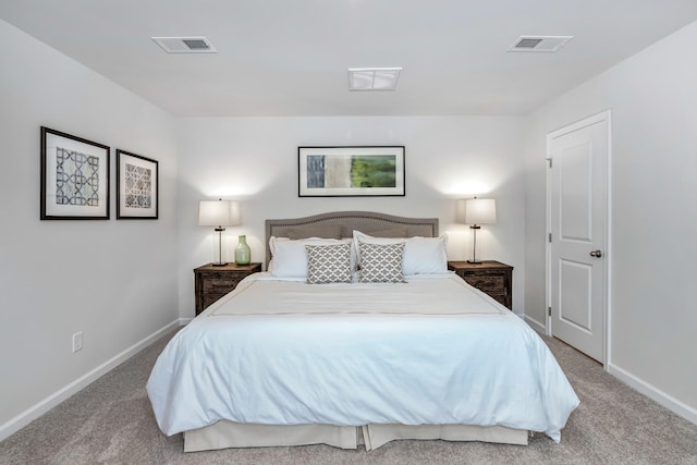 carpeted bedroom with baseboards and visible vents