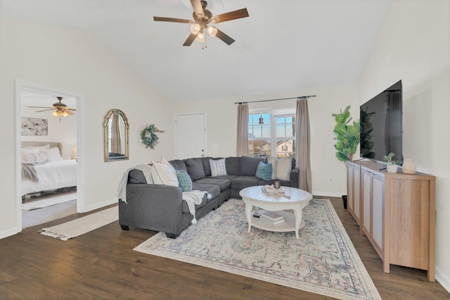 living room featuring dark wood-style floors, ceiling fan, lofted ceiling, and baseboards