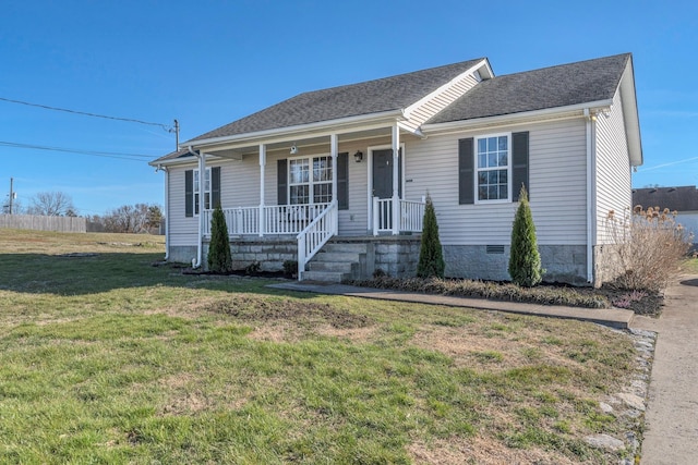 view of front of property with a front lawn, covered porch, a shingled roof, and crawl space