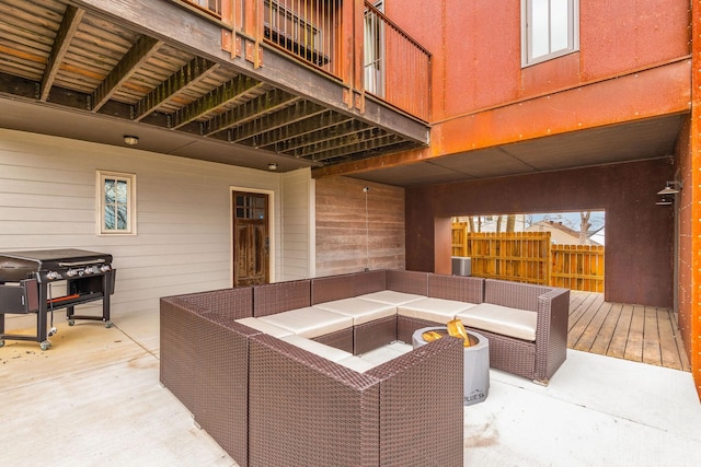 view of patio with an outdoor hangout area, a grill, and fence