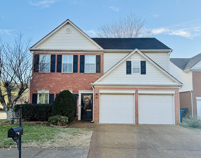 traditional-style house featuring a garage, brick siding, and driveway