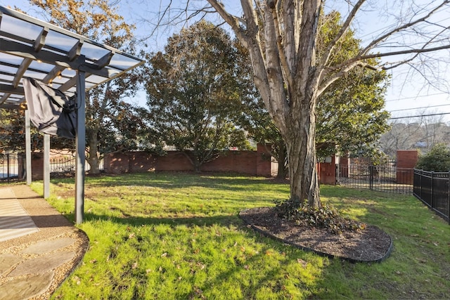 view of yard featuring a fenced backyard and a pergola