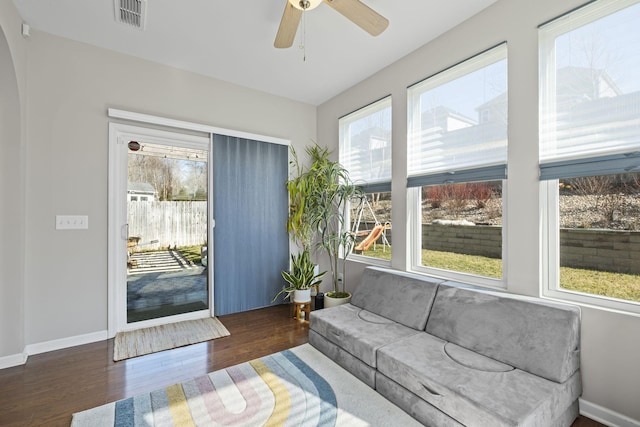 interior space featuring a ceiling fan, visible vents, and a healthy amount of sunlight