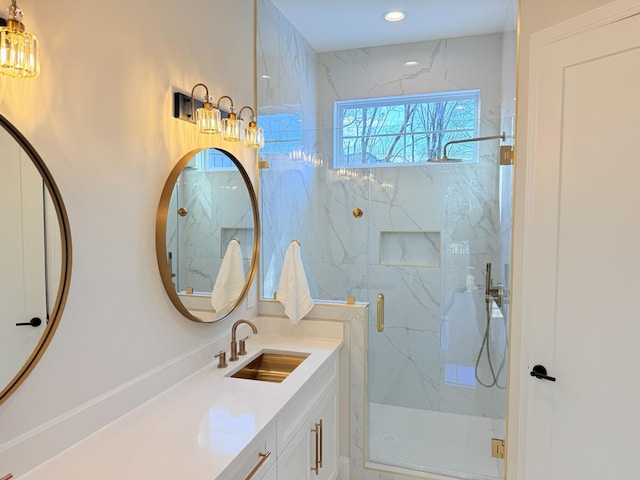 full bathroom with recessed lighting, vanity, and a marble finish shower