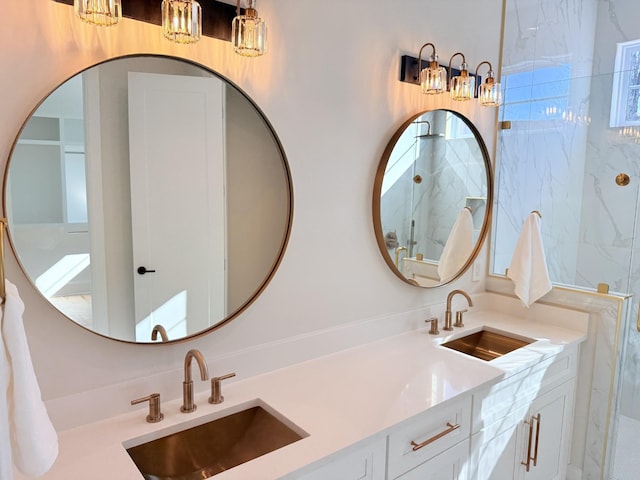 full bath featuring double vanity, a sink, and a marble finish shower