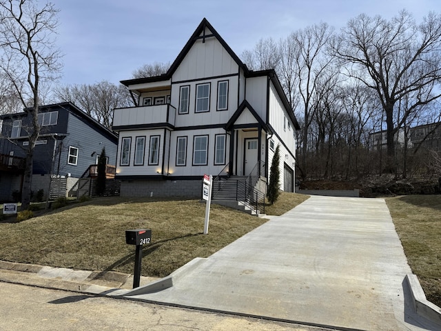 view of front facade featuring board and batten siding and a front yard