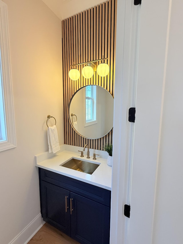 bathroom with vanity and baseboards