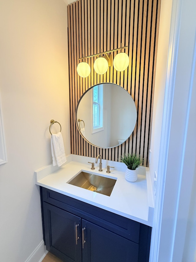 bathroom with vanity and baseboards