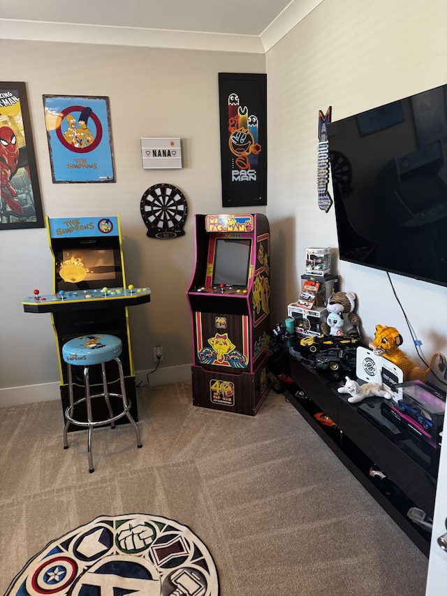 game room with carpet, ornamental molding, and baseboards