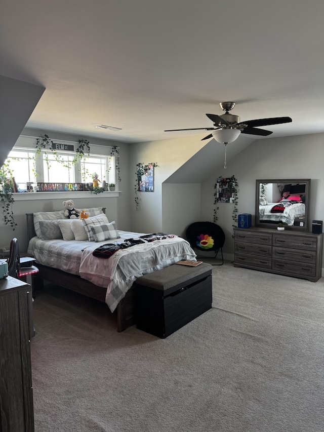 bedroom with visible vents, a ceiling fan, vaulted ceiling, and carpet flooring