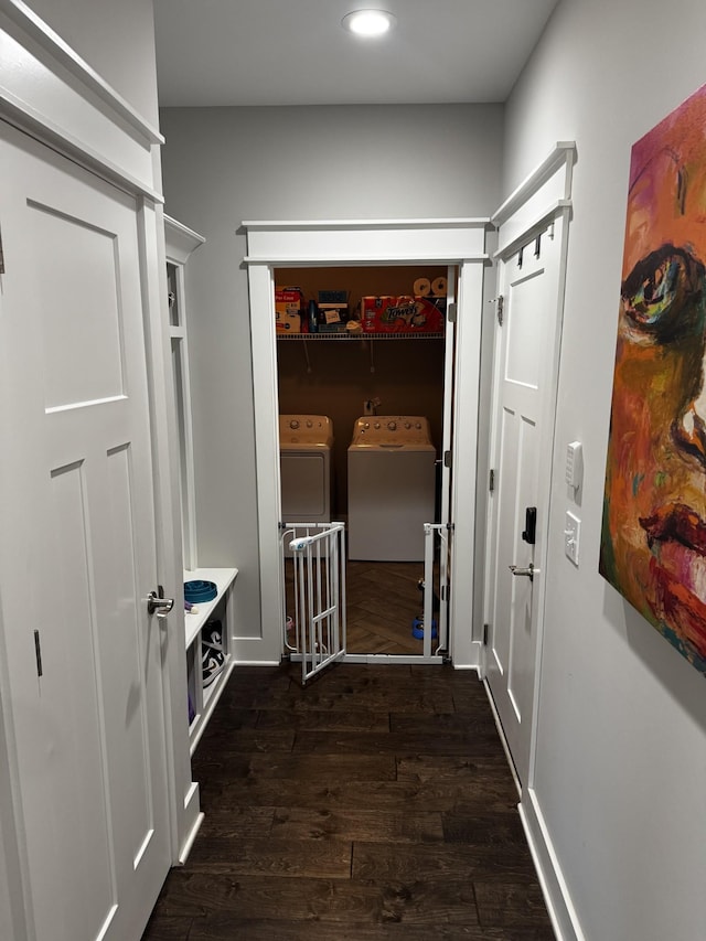 hall featuring recessed lighting, washer and clothes dryer, and wood finished floors