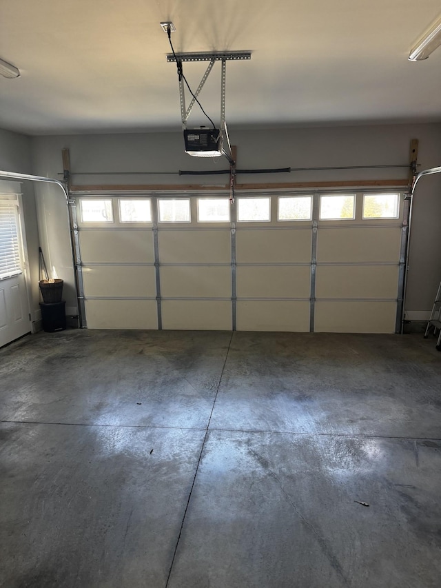 garage featuring a garage door opener