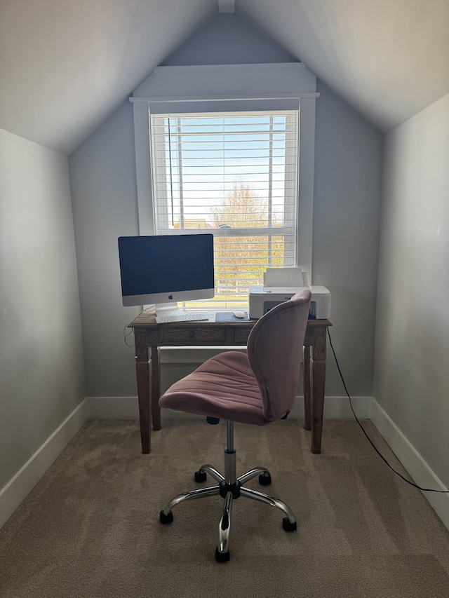 home office with baseboards, vaulted ceiling, and carpet flooring