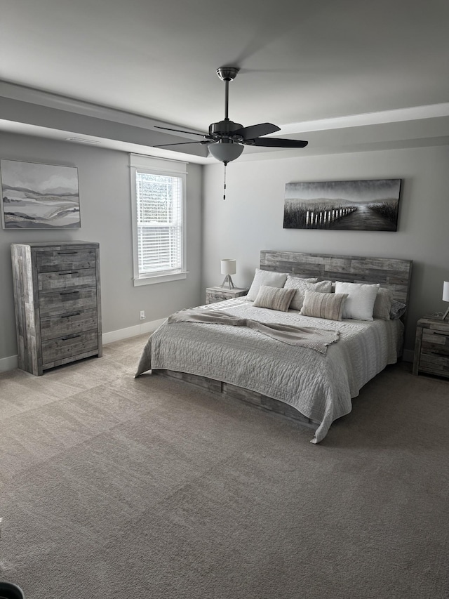 bedroom featuring ceiling fan, carpet flooring, and baseboards