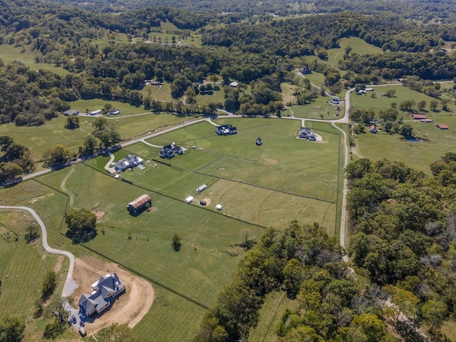 birds eye view of property with a rural view