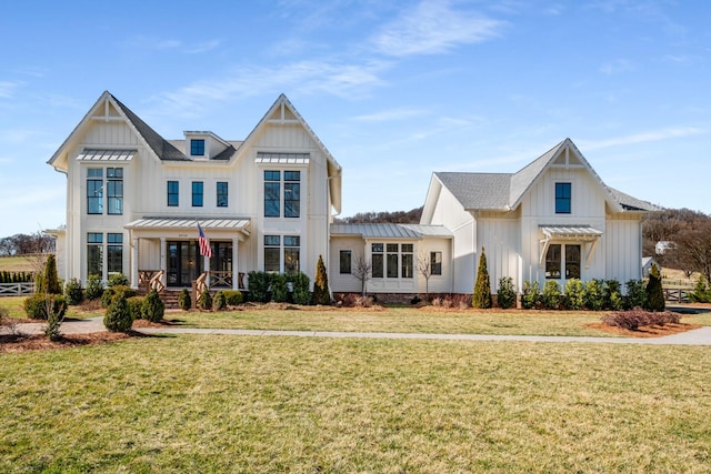 view of front of house featuring a standing seam roof, a pergola, board and batten siding, and a front yard