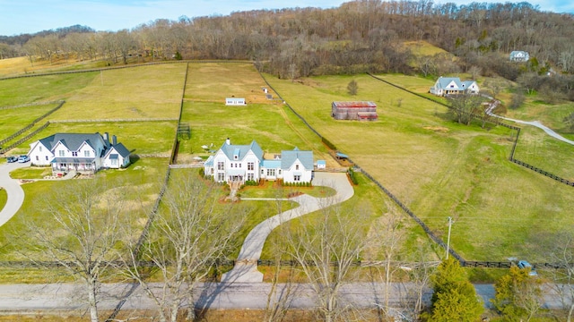 birds eye view of property featuring a rural view