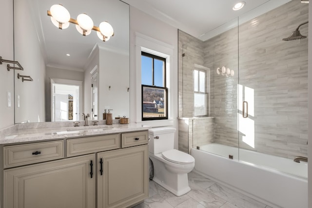 bathroom with toilet, ornamental molding, marble finish floor, combined bath / shower with glass door, and vanity