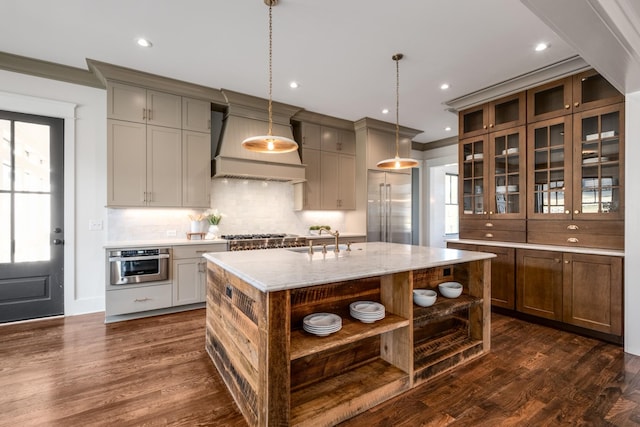 kitchen featuring open shelves, custom range hood, appliances with stainless steel finishes, dark wood-type flooring, and a sink