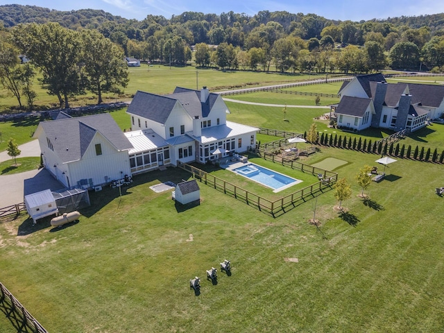 birds eye view of property featuring a rural view