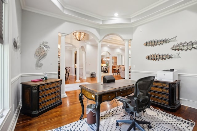 office featuring arched walkways, crown molding, ornate columns, and wood finished floors