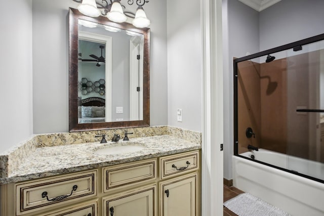 full bath with shower / bath combination with glass door, a fireplace, and vanity