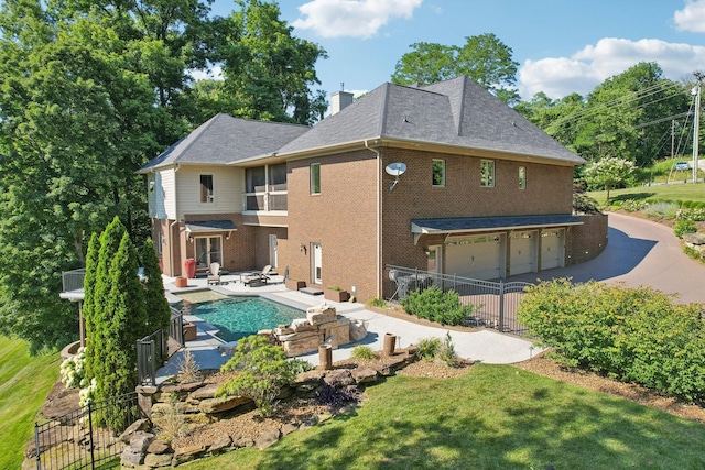 back of house featuring brick siding, a chimney, a patio area, and fence