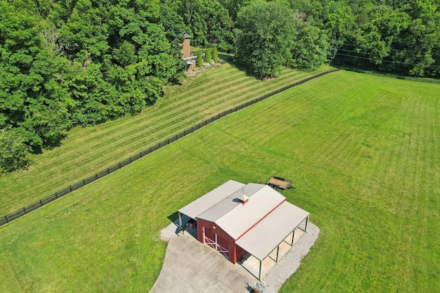 birds eye view of property with a rural view