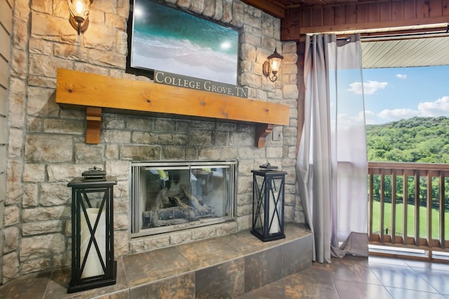 interior details with a stone fireplace