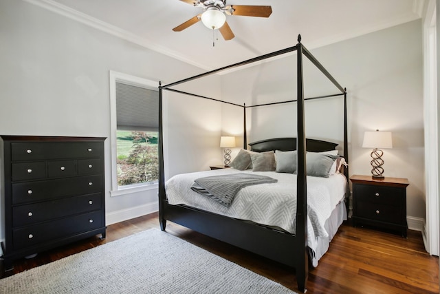 bedroom featuring ceiling fan, ornamental molding, wood finished floors, and baseboards