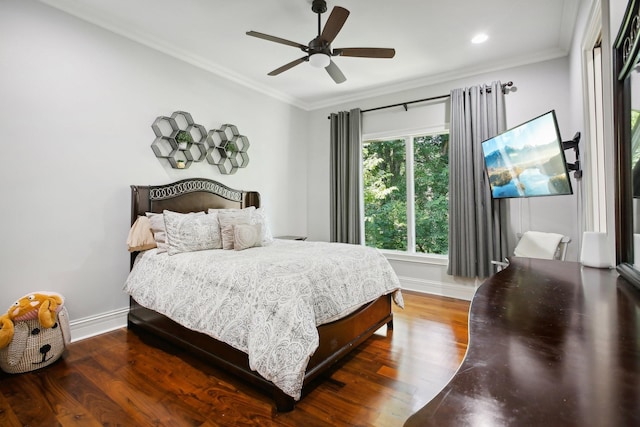 bedroom with baseboards, wood finished floors, and crown molding