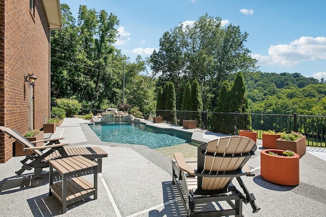 view of pool with a patio, fence, and a fenced in pool