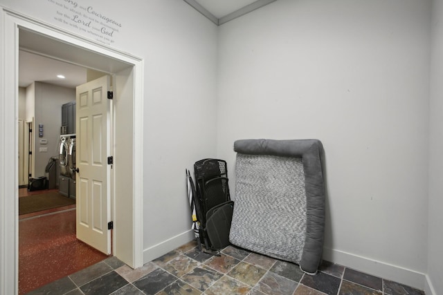 office area featuring stone tile flooring and baseboards