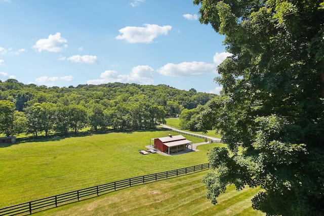 birds eye view of property featuring a forest view and a rural view