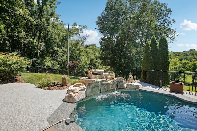 view of swimming pool featuring fence and a fenced in pool