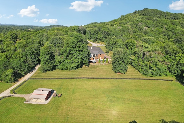 bird's eye view featuring a rural view and a wooded view