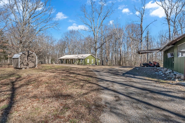 exterior space featuring an outbuilding and driveway