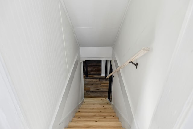 staircase featuring wood finished floors